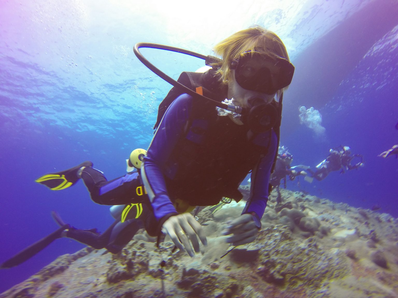 Under Pressure: 3 Important Rules When Deep-Sea Diving Alt="Underwater scuba diving selfie shot with selfie stick. Deep blue sea. Wide angle shot."