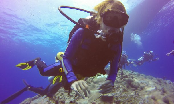 Alt="Underwater scuba diving selfie shot with selfie stick. Deep blue sea. Wide angle shot."