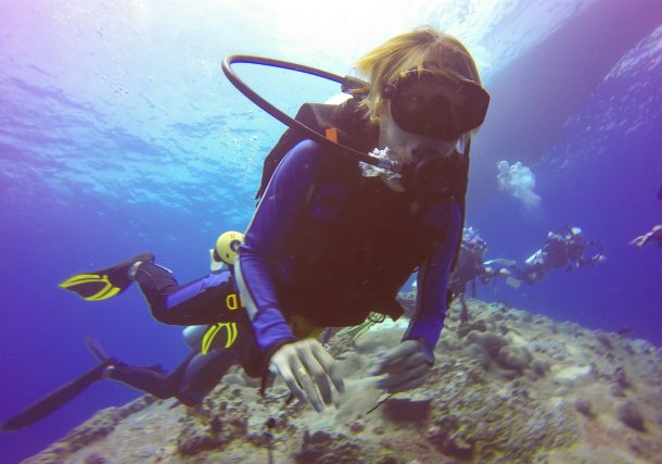 Alt="Underwater scuba diving selfie shot with selfie stick. Deep blue sea. Wide angle shot."