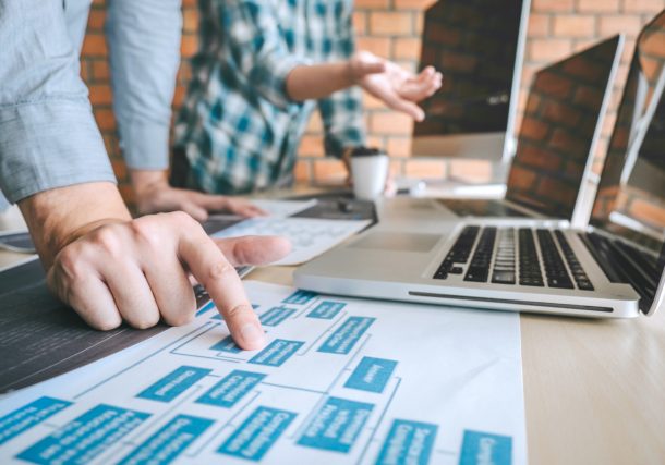 Alt="Professional Developer programmer cooperation meeting and brainstorming and programming in website working a software outsourcing and coding technology, writing codes and database."