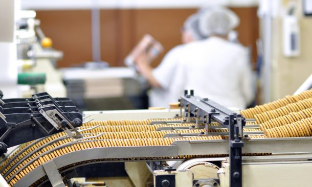 alt="food industry - biscuit production in a factory on a conveyor belt"
