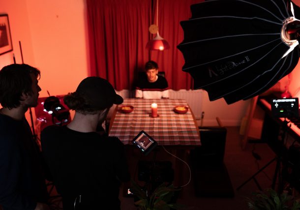 man in black shirt sitting on chair