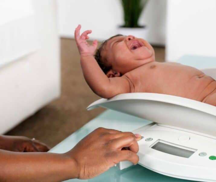 weighing baby