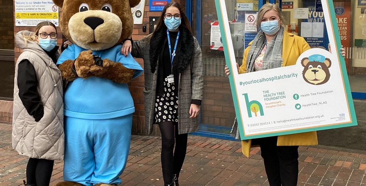 Staff from the Health Tree Foundation pictured with Scrubs the bear