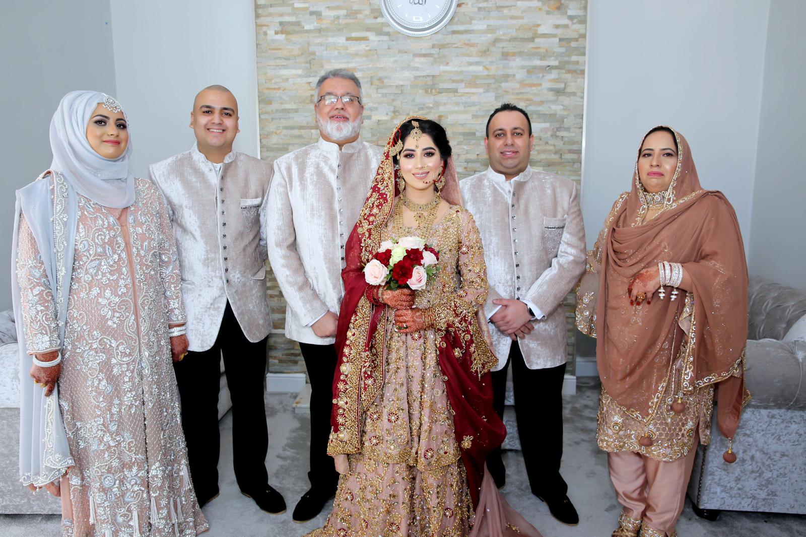 Mohammed Farooq and his son Amar Shazad with their family