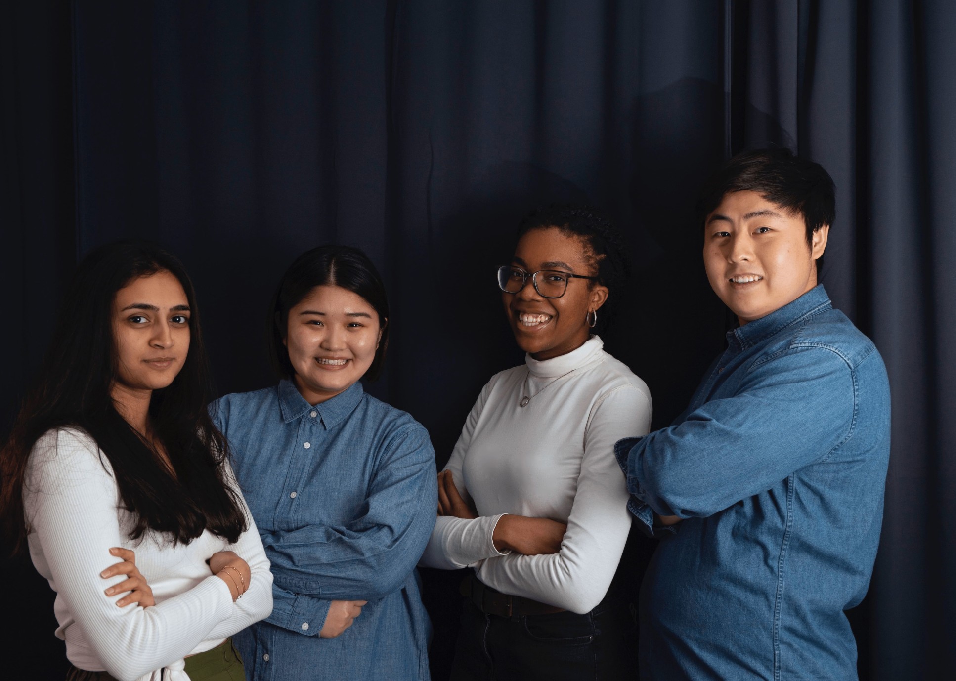 Four students standing in a line