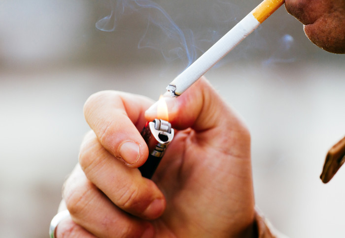 A person smoking a cigarette
