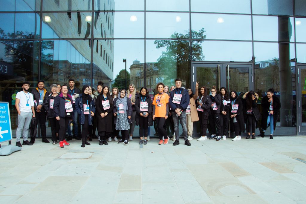 Group shot of students standing outside David Hockney Building
