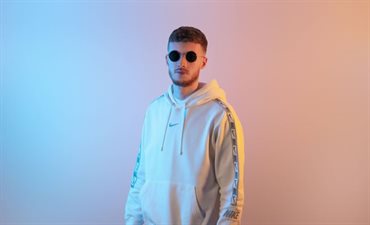 Ollie Crowe - Wearing sunglasses and White Adidas hoodie