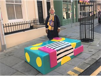 Colourful bench artwork with yellow circles