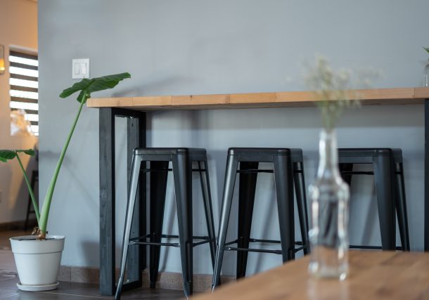 black metal frame on brown wooden table
