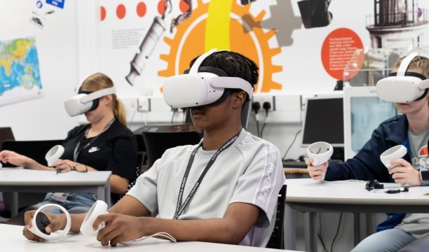 Students using VR headsets in class