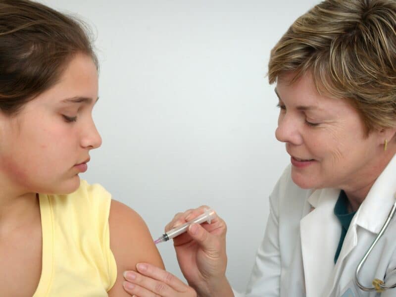 Young girl receiving her vaccination