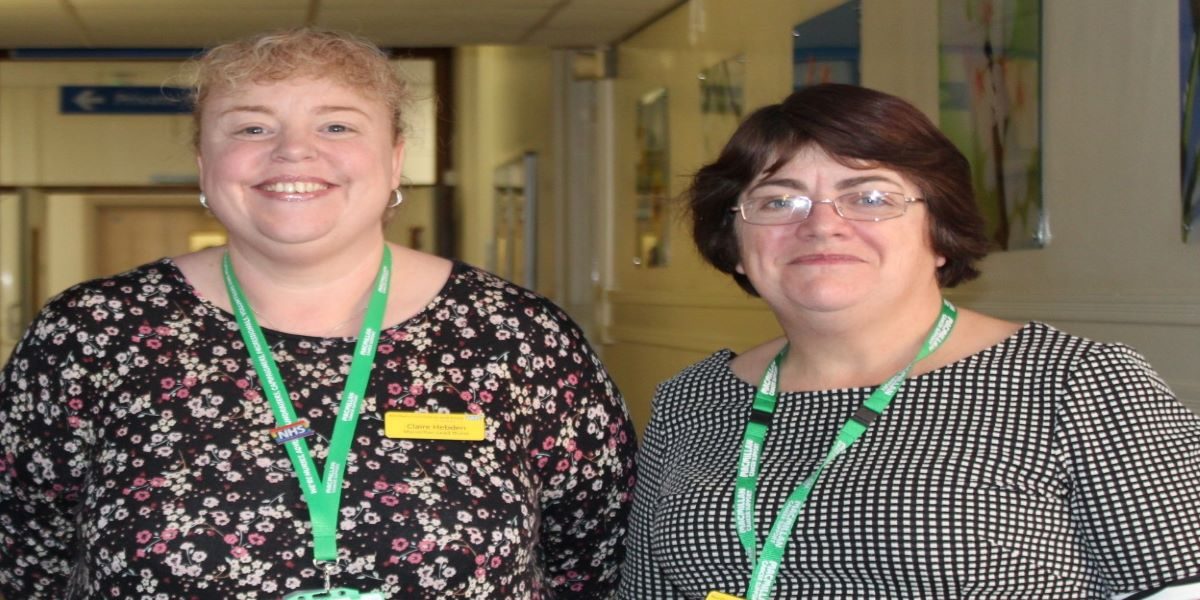 Two women - Claire Hebden and Julieann Woollas - standing side by side smiling.
