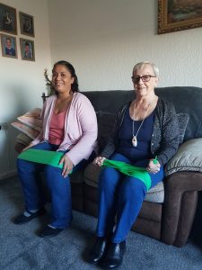 Julie (left) and Susie (right) exercising with resistance bands