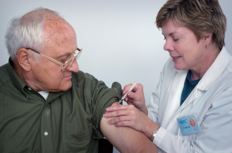 Elderly gentleman receiving his vaccine