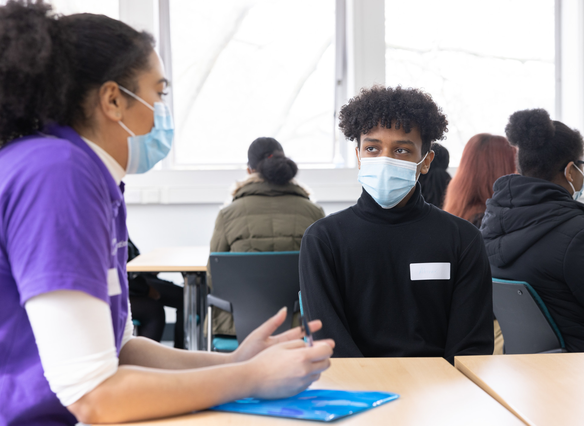 An Imperial student mentor talks to a local A Level student