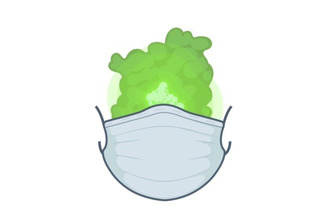 An illustration showing green smoke behind a surgical mask.