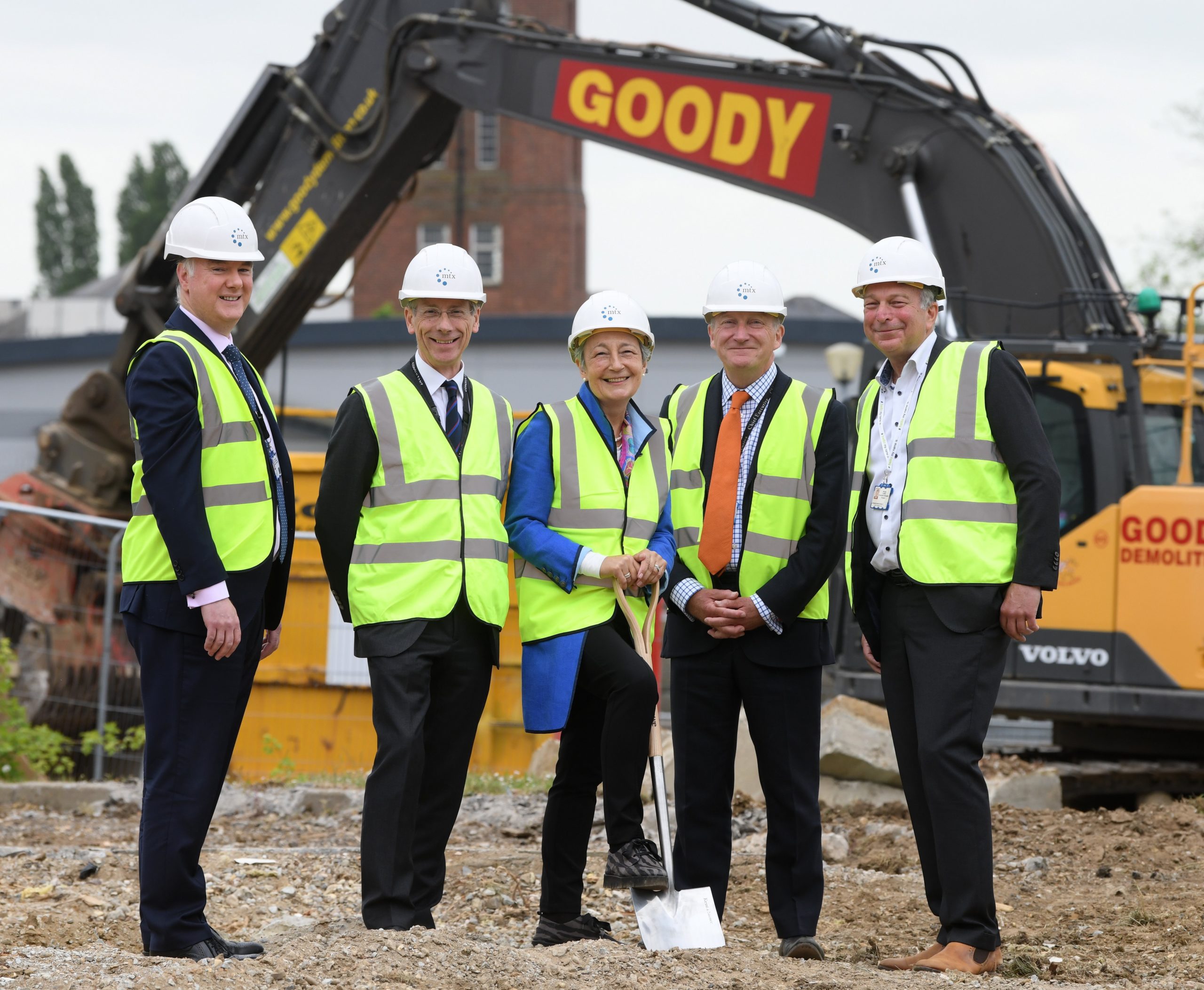 Dr Shane Gordon, Director of Strategy, Research and Innovation, Mr Mark Bowditch, Divisional Clinical Director and Orthopaedic Surgeon, Dame Clare Marx with a spade in the ground, Nick Hulme, CEO of ESNEFT, and Mr Mark Loeffler, consultant orthopaedic surgeon.