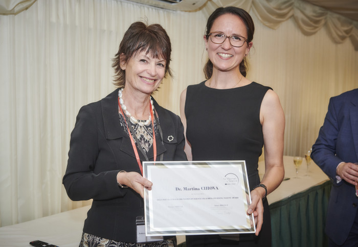 Dr Martina Cihova receiving her award from Professor Dame Anne Glover, Chair of the Jury Panel