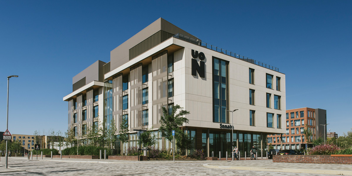 External view of Senate building at the University of Northampton, with a clear blue sky behind