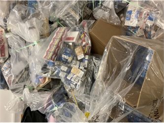 Plastic bags full of counterfeit cigarettes