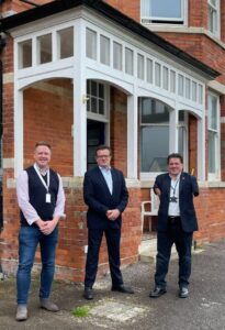 (l-r) Mike Graham, CEO at Lantern Trust, Andrew Billany, Director for Housing at Dorset Council and Cllr Graham Carr-Jones, Portfolio holder for housing stood together for a picture