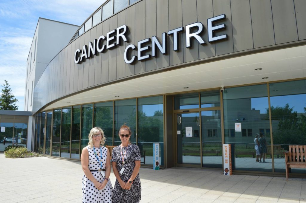 Gemma and Amy outside the Cancer Centre at MKUH