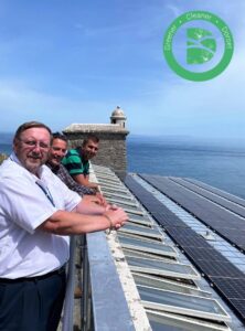 Cllr Bryan viewing new panels at Durlston Castle with Dorset Council's Climate & Ecological Sustainability Director and Sustainability Team Manager