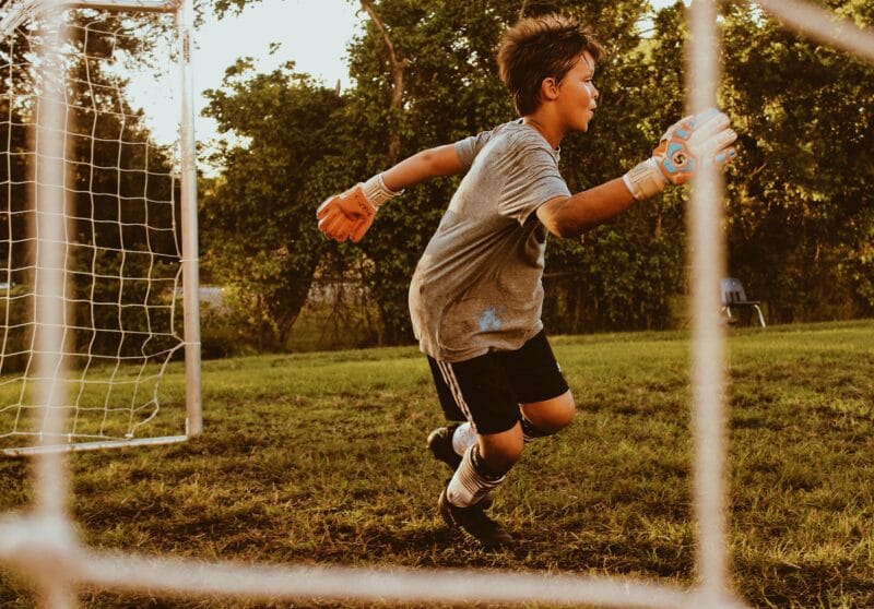 young boy playing football