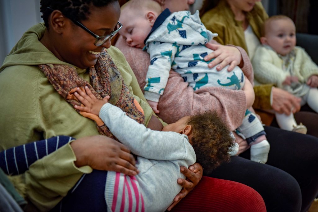 Local mum breastfeeding in The Broadway shopping centre