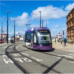Tram driving through new Blackpool North station extension
