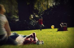 picture of little boy playing football