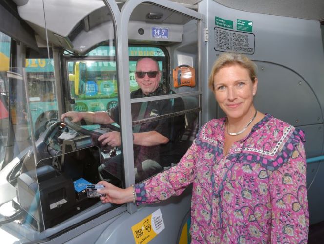 Transport Minister Baroness Vere tries the new Tap & Cap reduced bus fares scheme