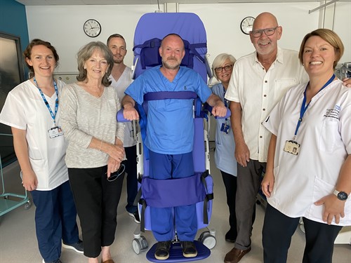 Staff and patient with chair