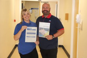 Dementia team stood in corridor with new strategy
