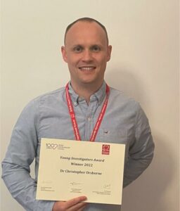 Dr Orsborne with his award certificate