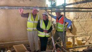Picture of Andrew McCarthy, Cllr Val Pothecary and Professor Philip Martin at the renovated cob walls