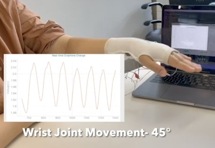 A screenshot of a video showing how flexible clothing sensors detect body movement.