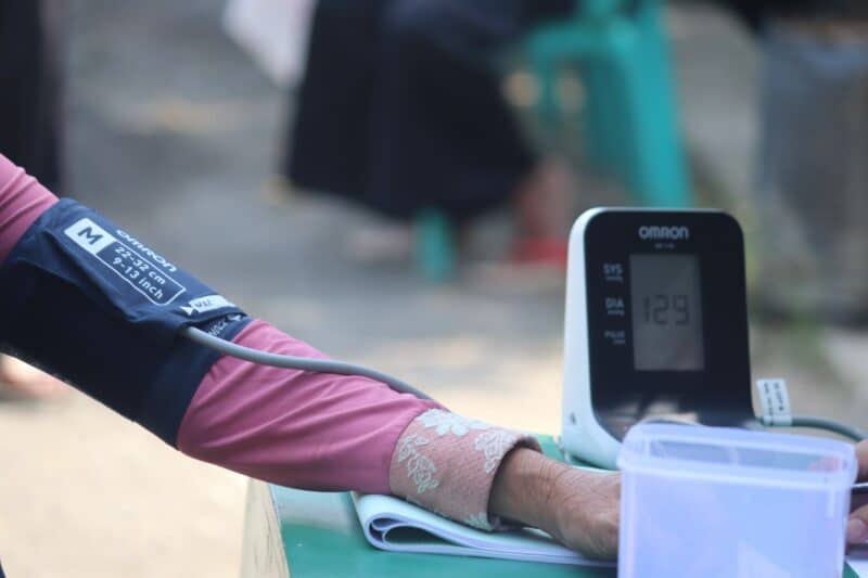 A person's arm and hand while having the blood pressure check