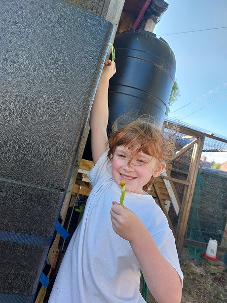 Young girl composting