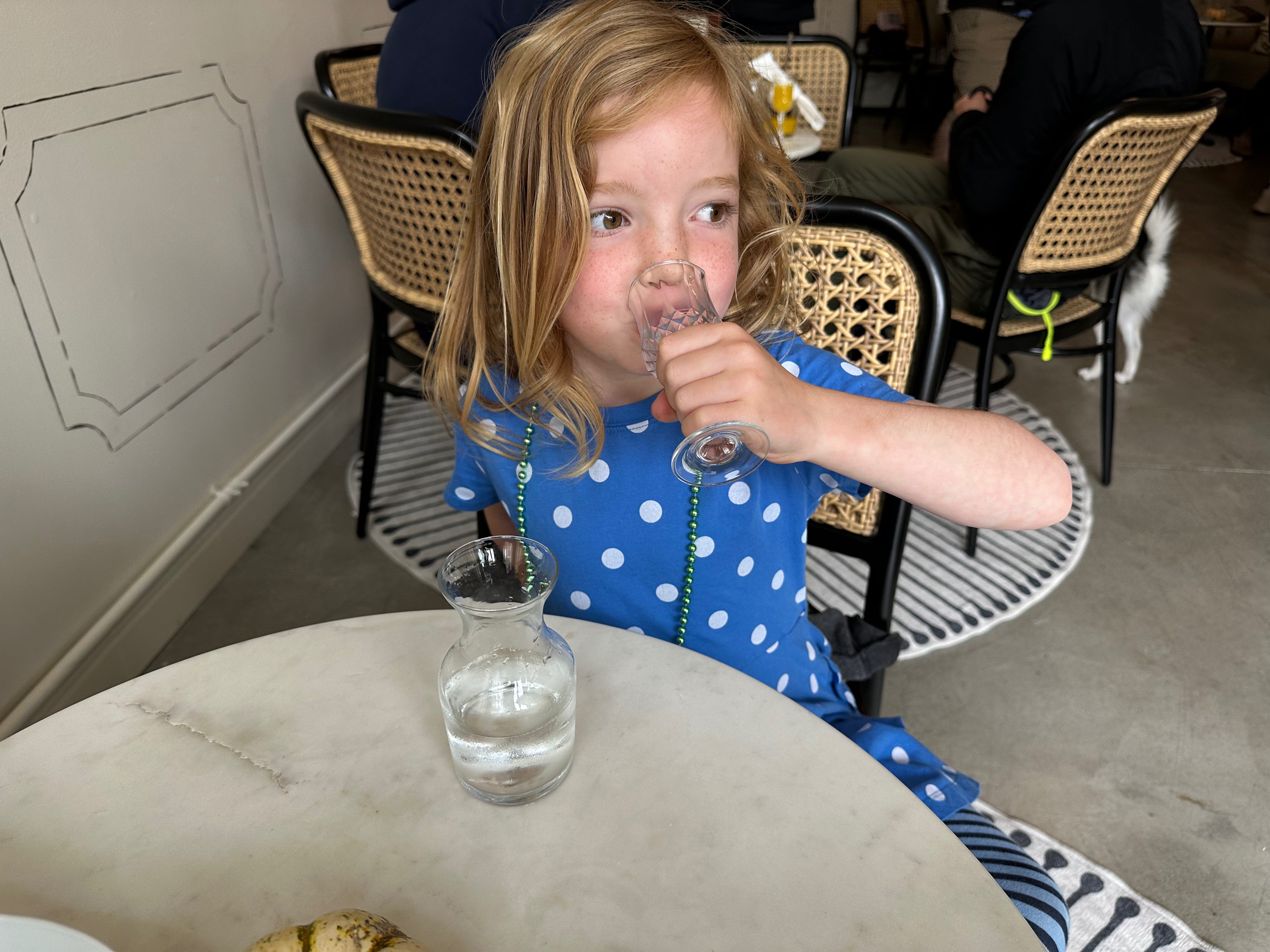 My daughter enjoys water from a small crystal goblet at Dogue.