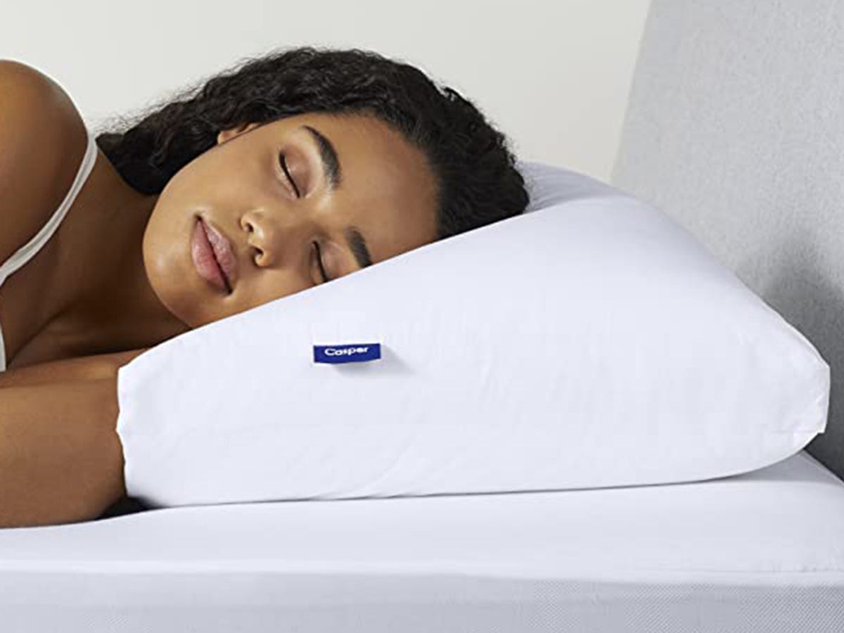 Person sleeping with their head on the Casper Original Pillow