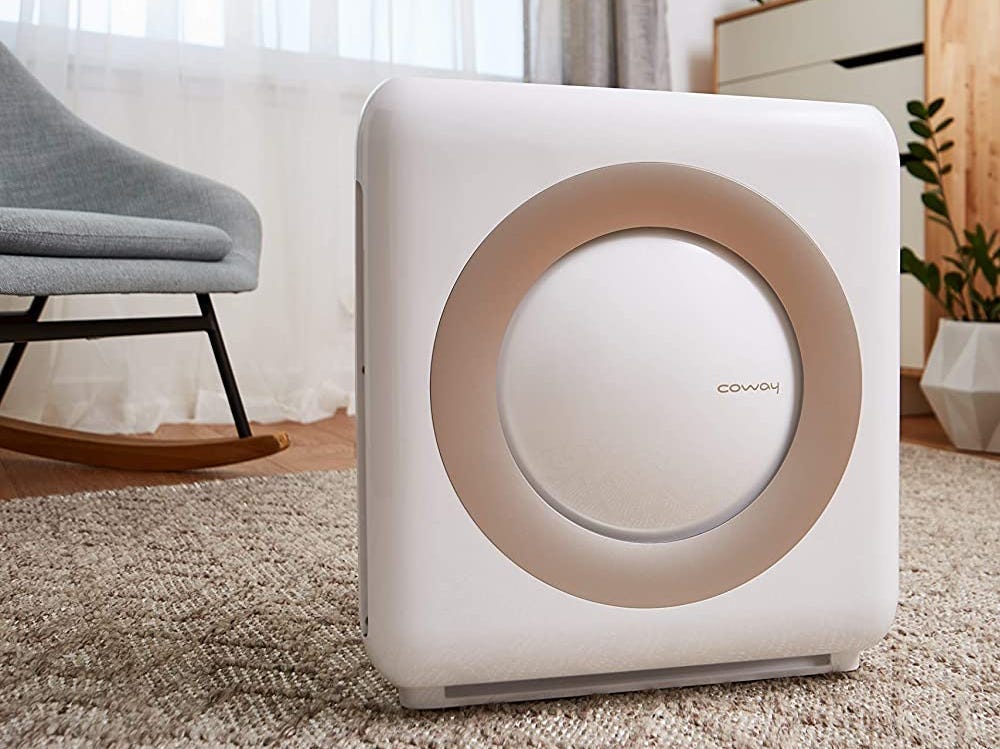 Prime Day 2022 air purifier deal: the Coway Airmega AP-1512HH Mighty on the floor next to a crib.