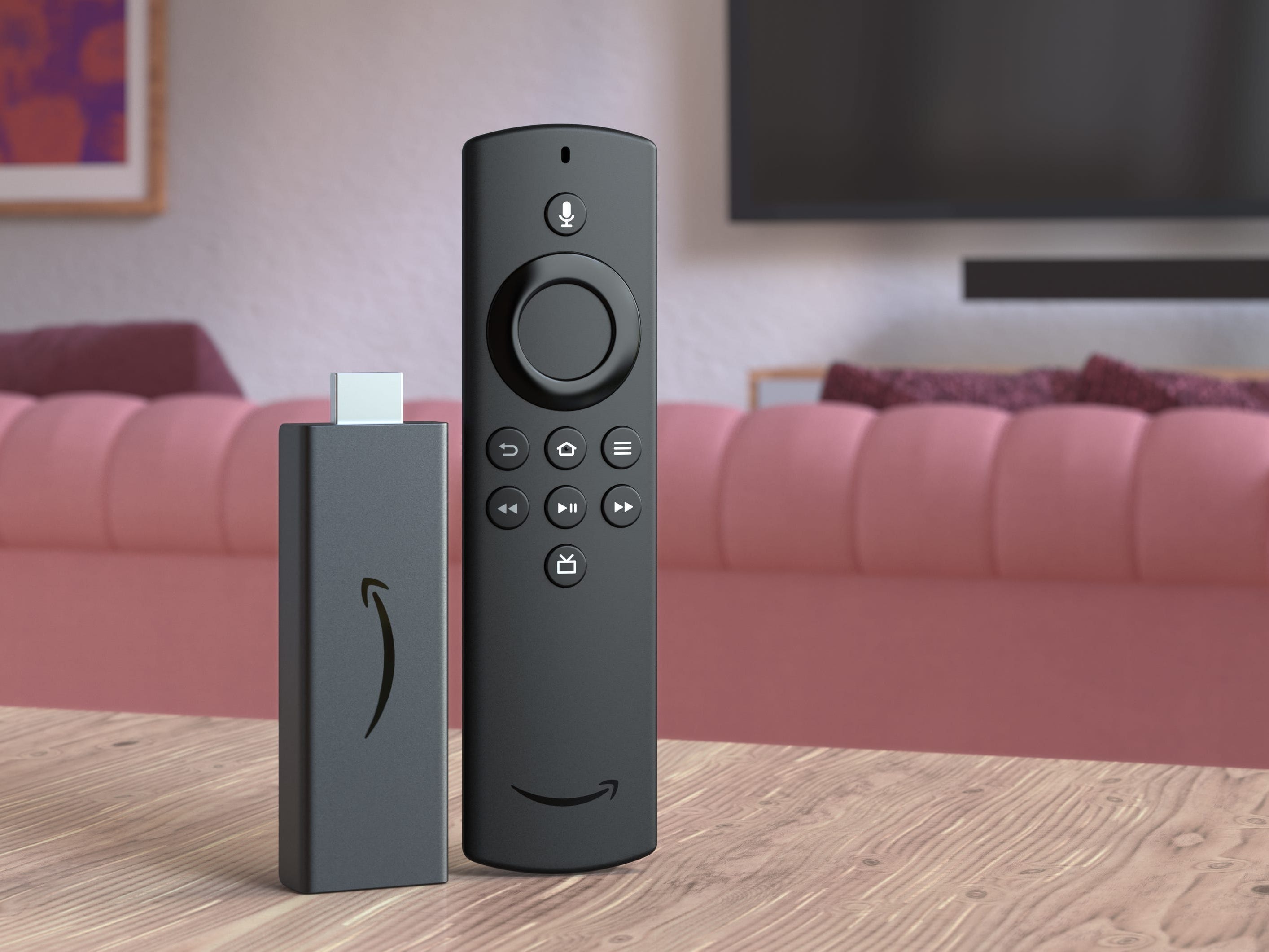Fire TV Stick Lite and remote on a tabletop in a living room.
