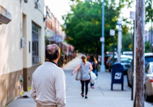 man standing outside looking forward