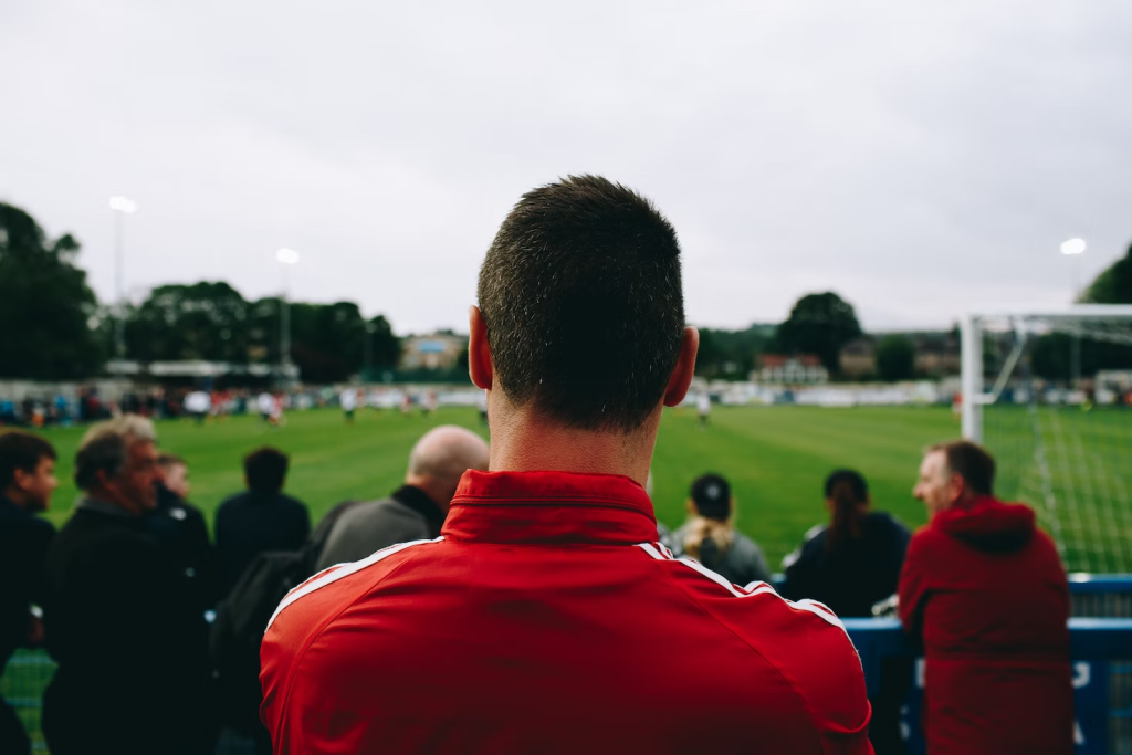 Man watching a football match with excitement and anticipation