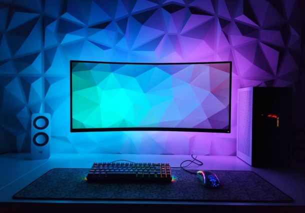 a computer monitor sitting on top of a desk