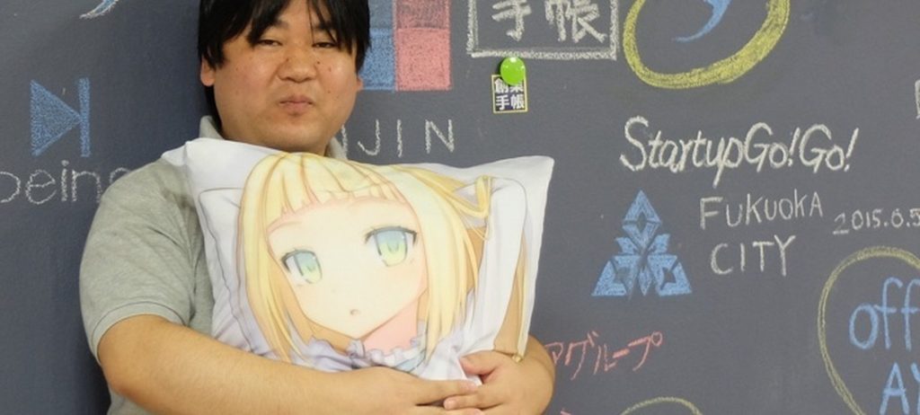 Man holds a pillow with a female anime character