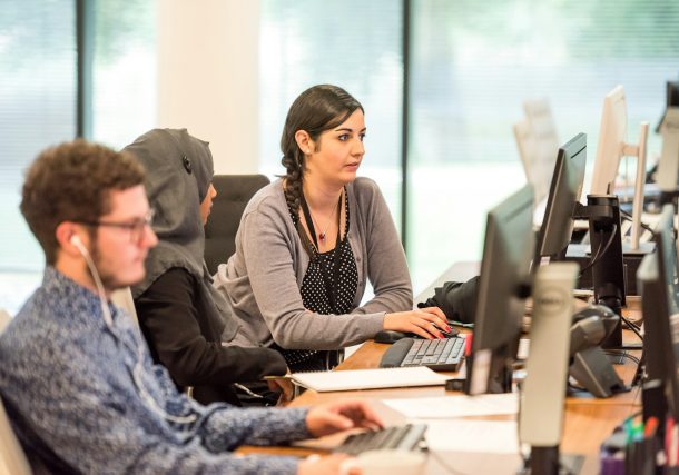 unknown persons using computer indoors
